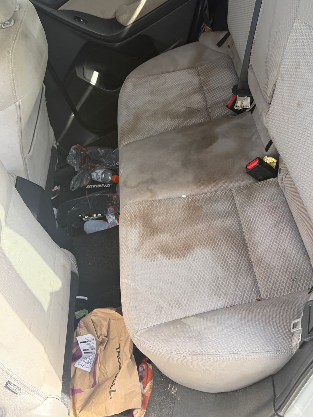 Vehicle rear seat before extraction and deep cleaning