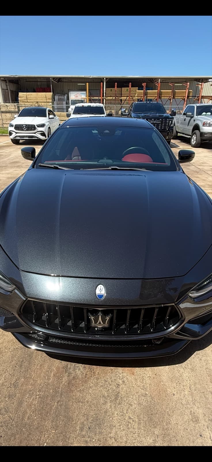 Dark vehicle after paint correction showing improved gloss and finish